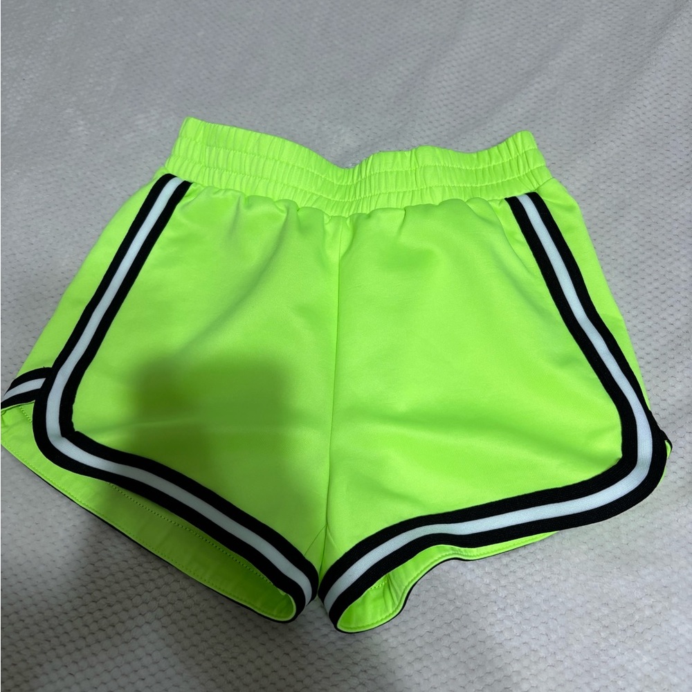 Neon green shorts with black and white stripes